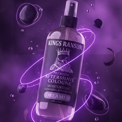 Bottle of Kings Ransom aftershave dreamer cologne on a purple background with floating bubbles.